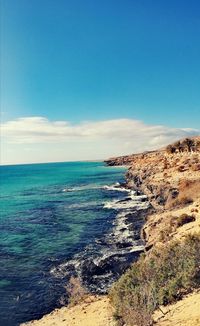 Scenic view of sea against blue sky