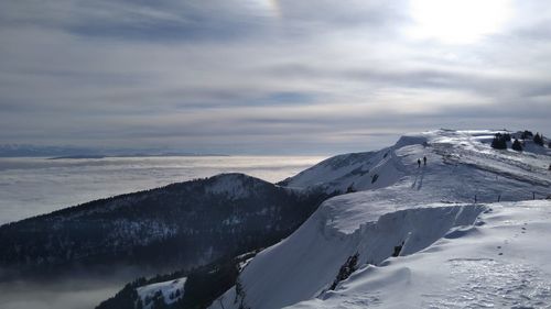 Scenic view of snowcapped mountains against sky
