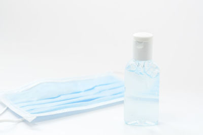 Close-up of glass bottle against white background