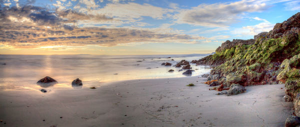 Scenic view of beach against sky