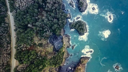 High angle view of rocks by sea