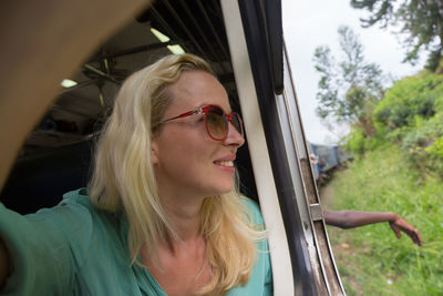 Portrait of mature woman in car