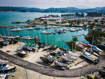 High angle view of boats moored in harbor