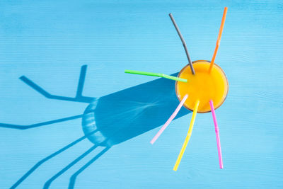 High angle view of drink against blue background