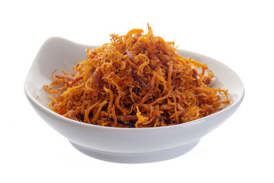 Close-up of pasta in bowl against white background