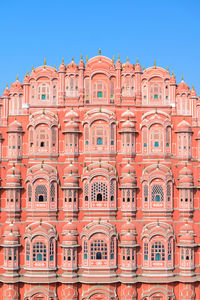 Low angle view of historical building against clear blue sky