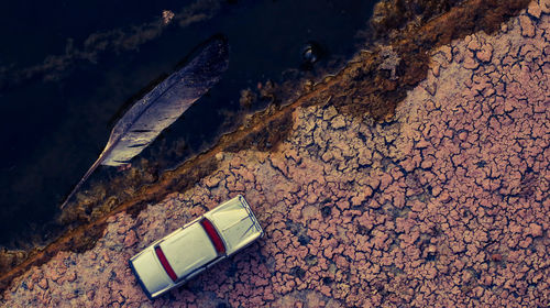 High angle view of book on rock