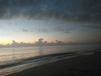 Scenic view of beach against sky during sunset