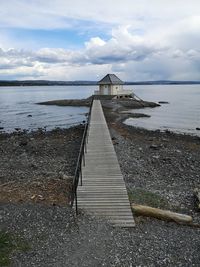 Pier over sea against sky