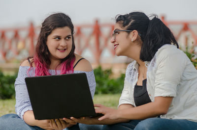 Young woman using mobile phone