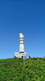 Lighthouse against clear blue sky