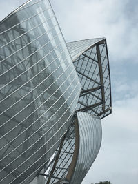 Low angle view of ferris wheel against sky