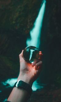 Close-up of hand holding finger