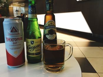 Close-up of beer bottles on table