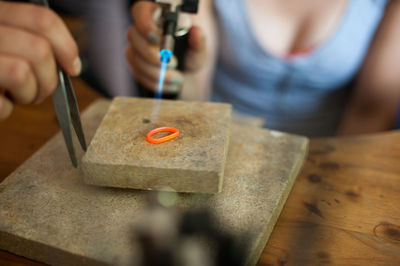 Cropped image of hands making ring