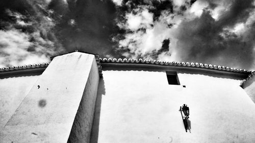 Low angle view of men against sky