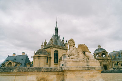 Low angle view of historic building against sky