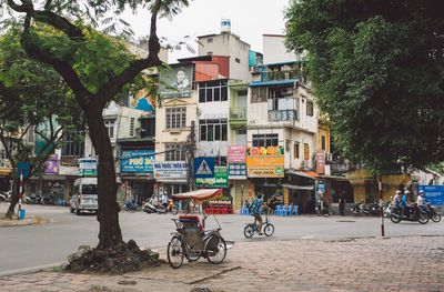 Buildings by street in city