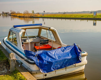 Boat moored on lake