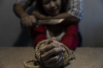 Close-up of man holding hands