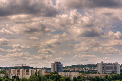 Buildings in city against sky