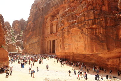 People against rock formations