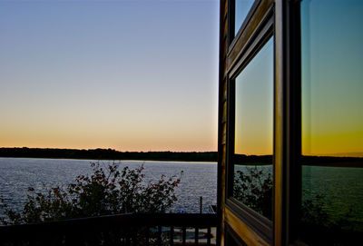 Scenic view of lake against sky at home