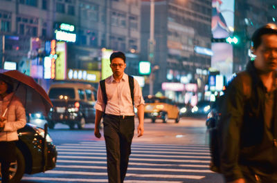 Woman standing on city street