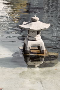 High angle view of cross on lake