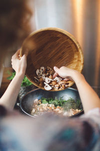 Midsection of woman holding ice cream in bowl