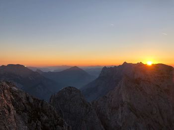 Scenic view of mountains against sky during sunset