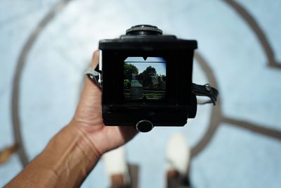 Close-up of hand holding camera phone