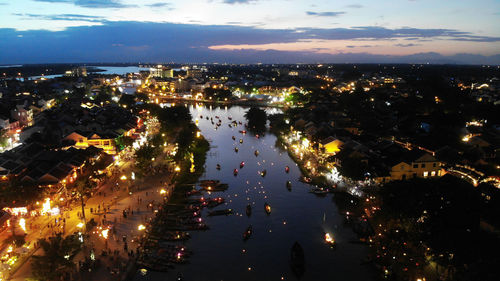 High angle view of illuminated city buildings at night