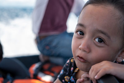 Portrait of a sad asian child outdoor.