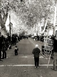 People walking on road in city