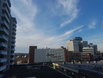 Buildings in city against sky