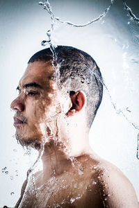 Portrait of shirtless man in water