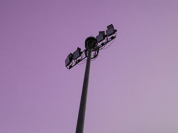 Low angle view of street light against pink sky