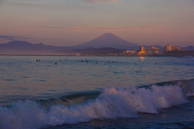 Scenic view of sea against sky at sunset