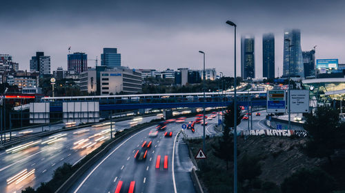 Traffic light trails on highway in city