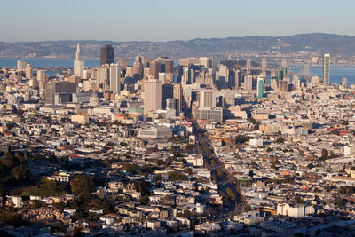 High angle view of buildings in city against clear sky