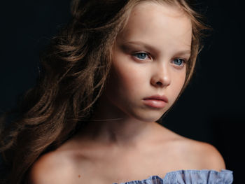 Close-up portrait of a serious young woman