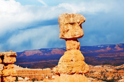 Stack of rock on mountain against sky