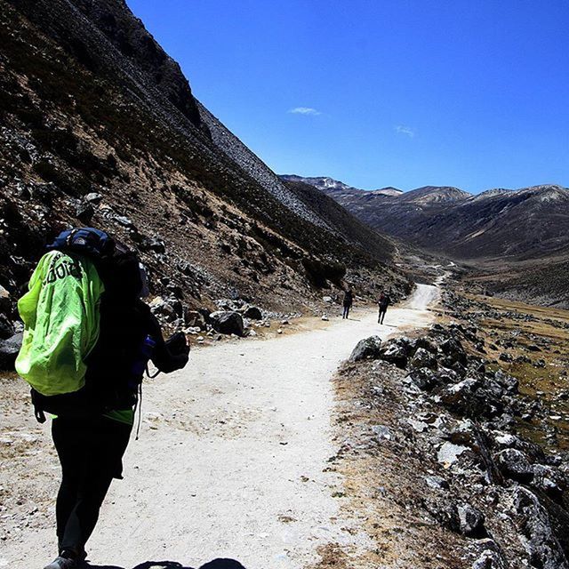 mountain, lifestyles, leisure activity, rear view, men, full length, snow, winter, cold temperature, hiking, mountain range, standing, walking, backpack, sky, warm clothing, landscape, nature