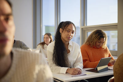 Portrait of smiling woman in class