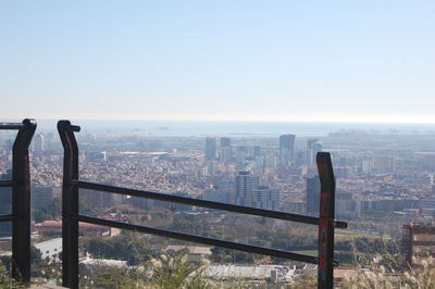 View of city buildings against clear sky