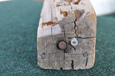 Piece of wood with embedded bullets