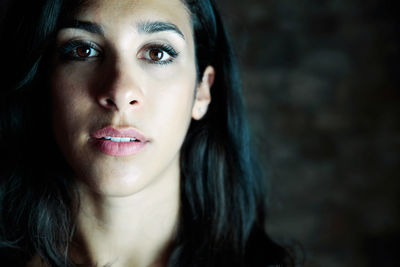 Close-up of young woman looking away