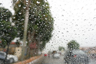 Raindrops on glass window during rainy season