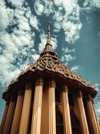 Low angle view of building against cloudy sky